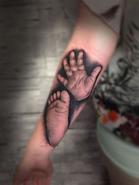 Baby Williams's hand and foot prints. Memorial tattoo. The