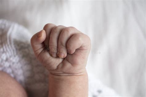 Baby With Fist Up