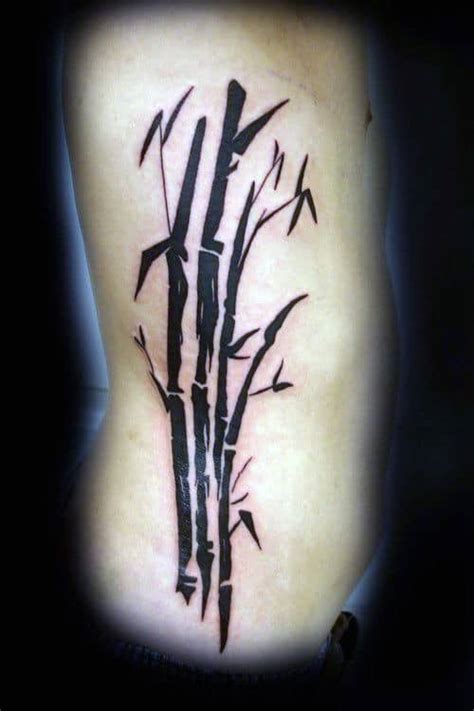 Black Bamboo Tattoo On Knee Blurmark