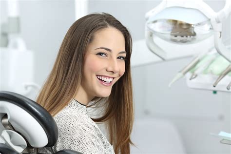 Young Beautiful Woman Dentist Holding Denture Cast Model Stock Image