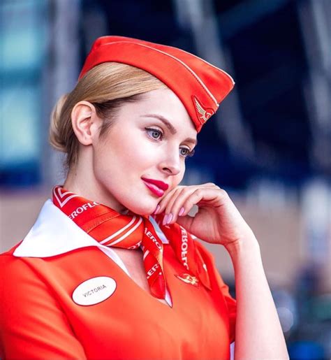 Take to the Skies with Elegance: Behold the Beauty of Our Breathtaking Female Flight Attendants - A SEO Title that will attract attention and inspire admiration for the stunning women who grace the skies with their poise and grace.
