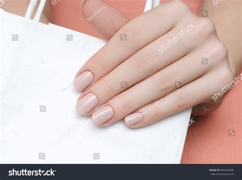 Beautiful Female Hand Beige Nail