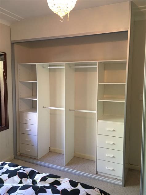 Bedroom with built-in wardrobe and storage solutions