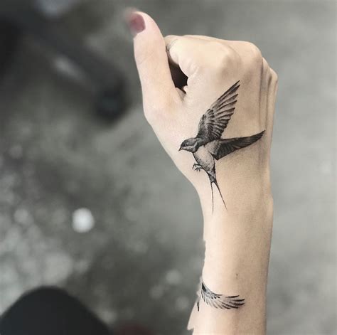 Bird Tattoo In Hand