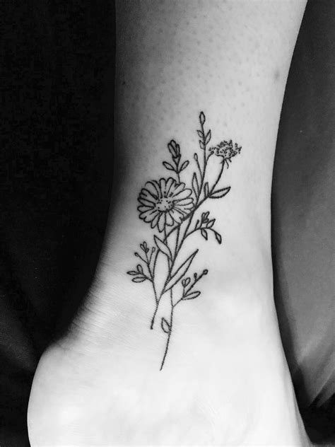 black and white detailed floral tattoo on side thigh