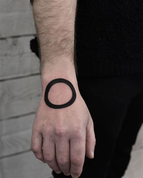Tattoo inspiration 33 black circle tattoos One Hand in