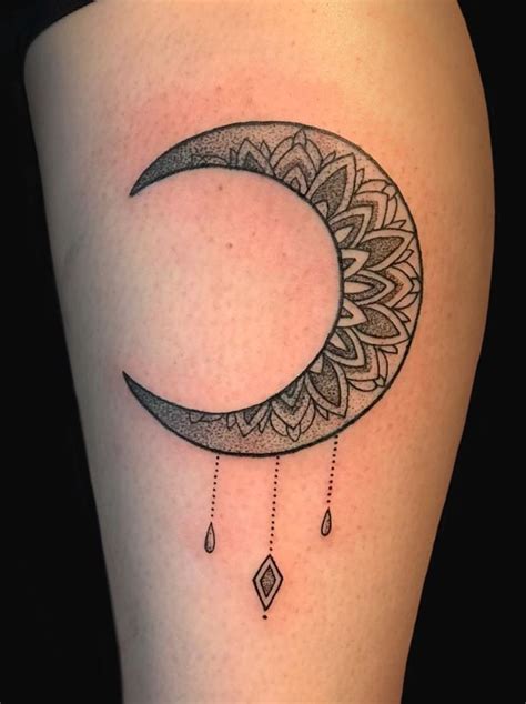 simple black moon tattoo on shoulder