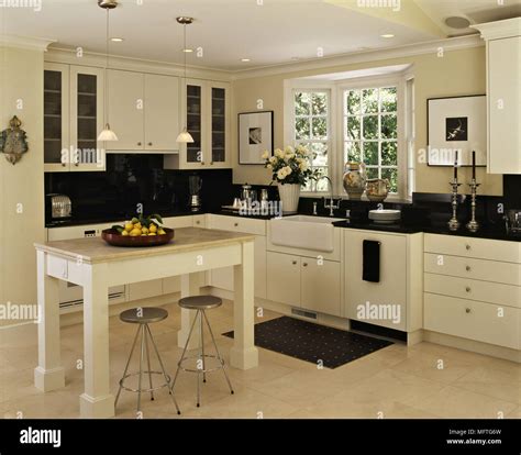 Indulge in the Classic Elegance of Black and Cream Kitchen Decor: A Timeless Combination for Your Home