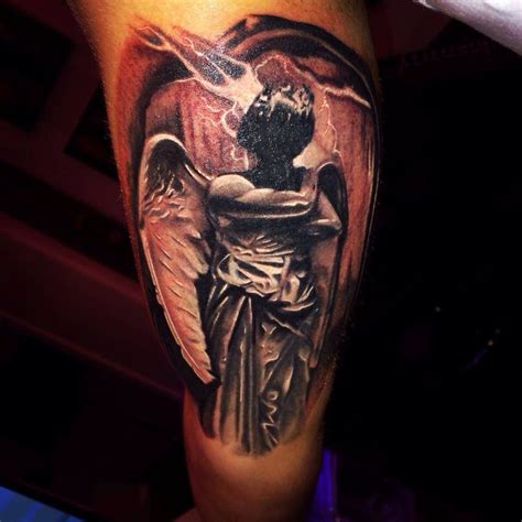 Black and grey realistic angel tattoo by Brandon Albus at