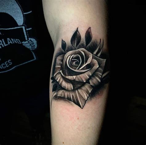 Realistic rose tattoo black and gray by Cody Brigan