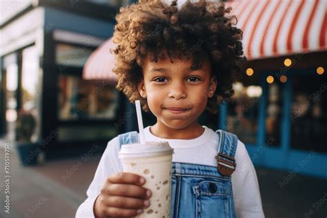 Black Kid Drinking Milkshake