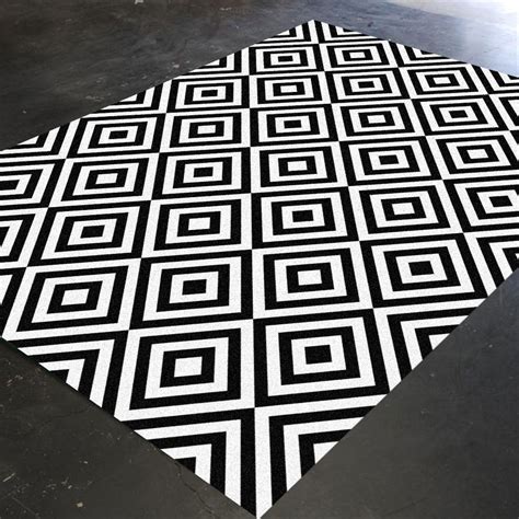 Black and white geometric patterned rug in bedroom