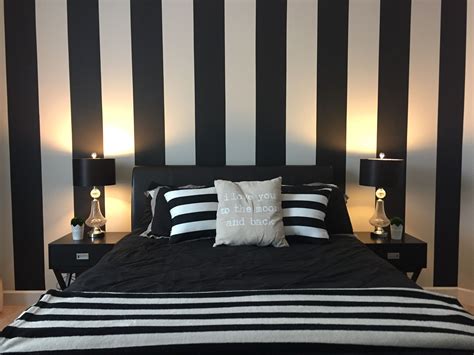 Black and white striped wallpaper in bedroom