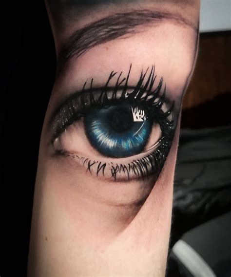 Realistic Blue Eye on Wrist Tattoo by Izzy Garcia