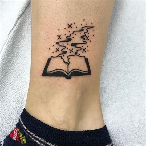 Wonderful tattoo for book lovers with quote Book tattoo