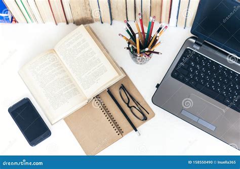 Books and pencils on notebook