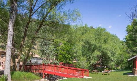 Boulder Adventure Lodge rustic exterior with pool