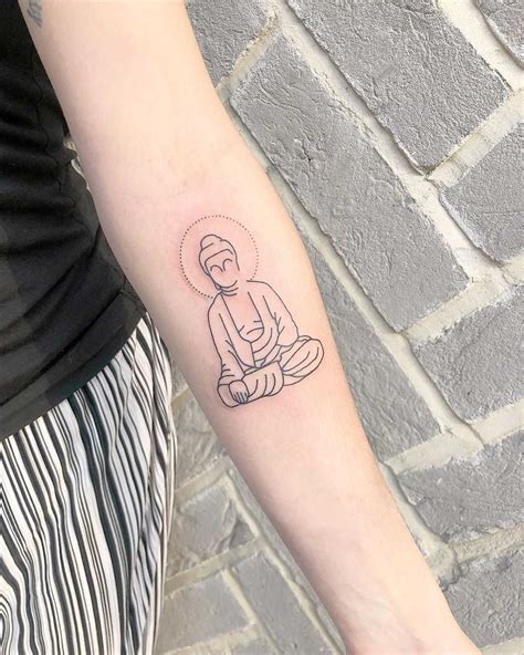 Small Buddha tattoo by Tess at Divine Ink Tattoo Buddha