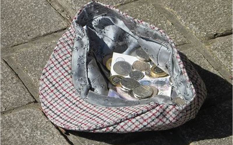 Button The Busker With A Pile Of Money