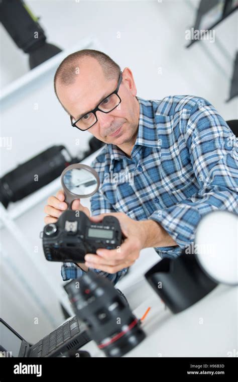 Camera Repair Seattle WA - Technician Examining a Camera