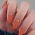 Captivate Hearts with Your Nails: Adorn Them with Striking Burnt Orange Nail Art