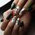 Captivating Greenery: Adorn your nails with captivating dark green fall art
