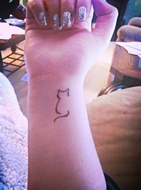 Cat wrist tattoo Wrist tattoos, Tattoos, Leaf tattoos