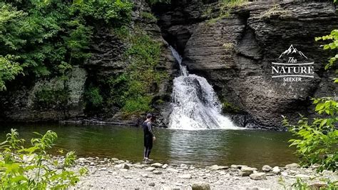 A hiker enjoying scenic views from a mountaintop in the Catskills