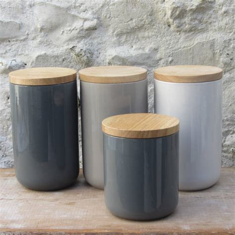 ceramic storage jars with wooden lids by horsfall & wright