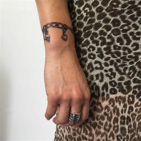 I love my charm bracelet tattoo! Ink by Bri Crepinsek