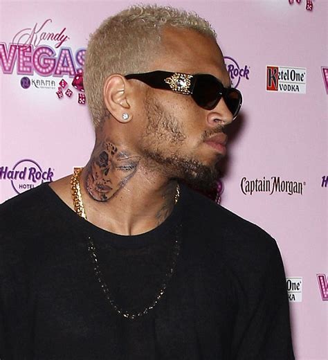Chris Brown gets more tattoos on his neck as he snoozes