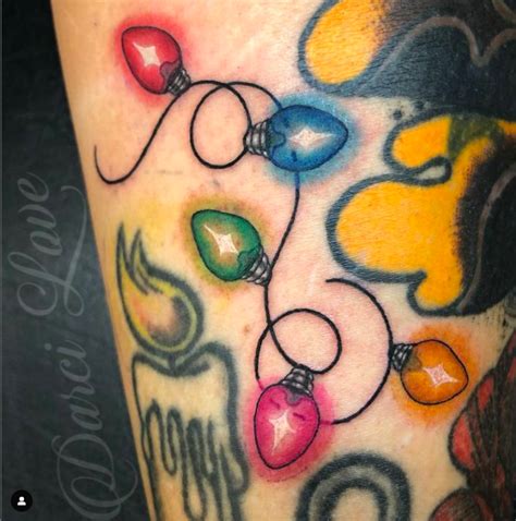 Discover Festive Charm with Stunning Christmas Lights Tattoos!
