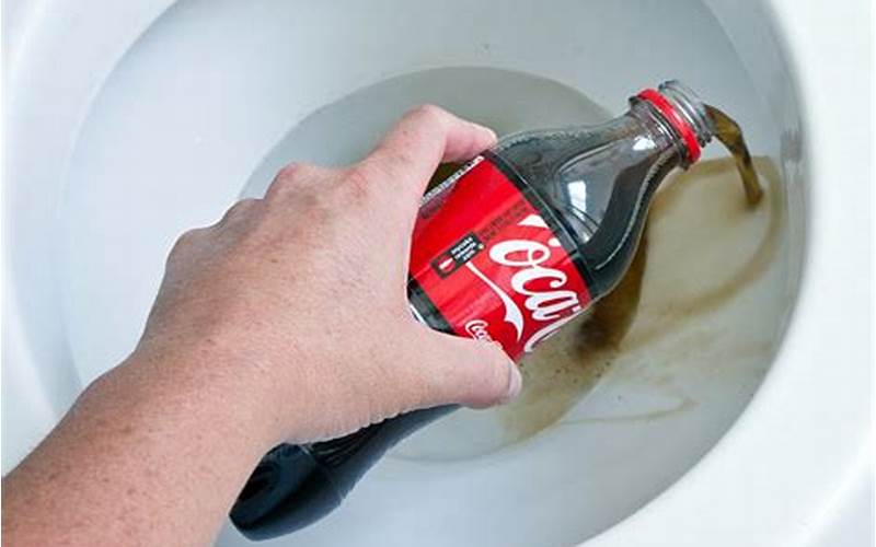 Cleaning Toilet With Coca-Cola