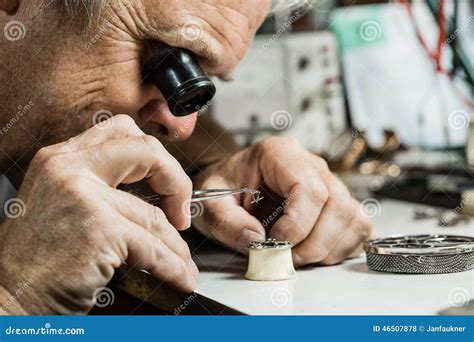 Clockmaker repairing a watch