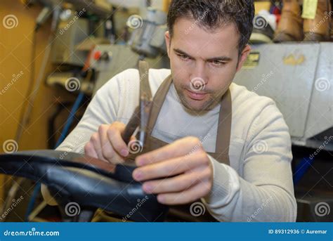 Cobbler Repairing a Shoe