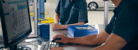 Collision Repair Technician Using Computer