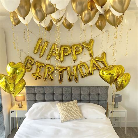 Colorful streamers and balloons decorating a bedroom