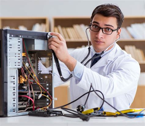 Computer Repair Technician Inspecting a Desktop