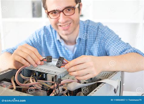 Computer Technician Working on a PC