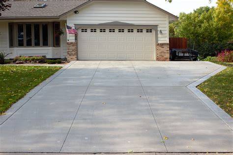 Gray Brushed Concrete Driveway with Tan Colored Seamless Slate Stamped