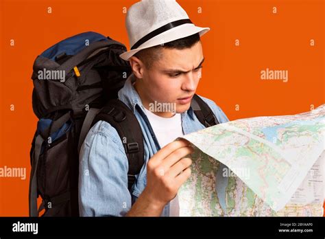 Confused Traveler Looking at Map