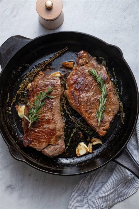 Cooking sliced chuck steak in a skillet