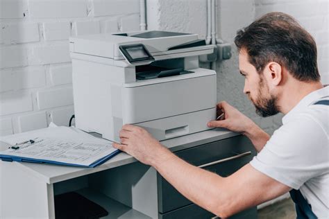 Copier Repair Technician Inspecting a Machine