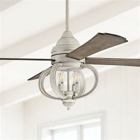 The Turn of the Century® Belle 52” ceiling fan with tiffanystyle glass shade creates a French