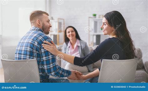 Couple holding hands in couples therapy Springfield IL