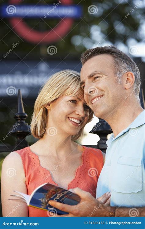Couple with guidebook