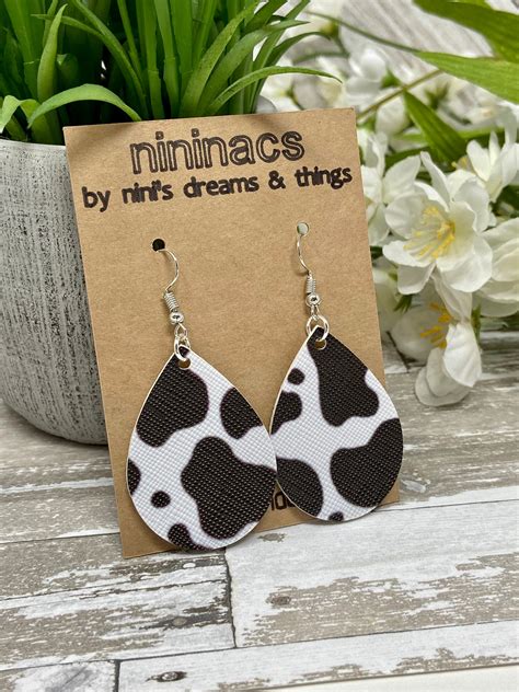 Get Spotted in Style with Cow Print Earrings - Shop Now!