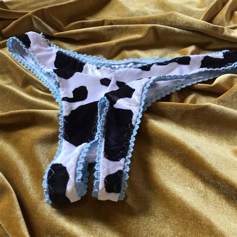 Unleash Your Wild Side with Cow Print Thongs - Shop Now!