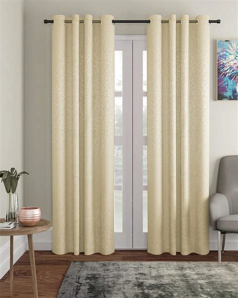 Cream-colored curtains in a living room