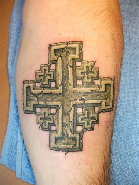 Jerusalem cross tattoo on the neck.